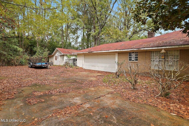 view of property exterior with a garage