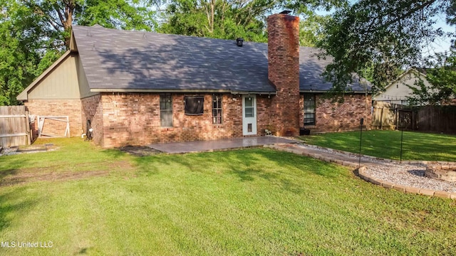 118 Dogwood Trl, Brandon, MS 39047 - rear view of house with brick siding, a chimney, and a shingled roof