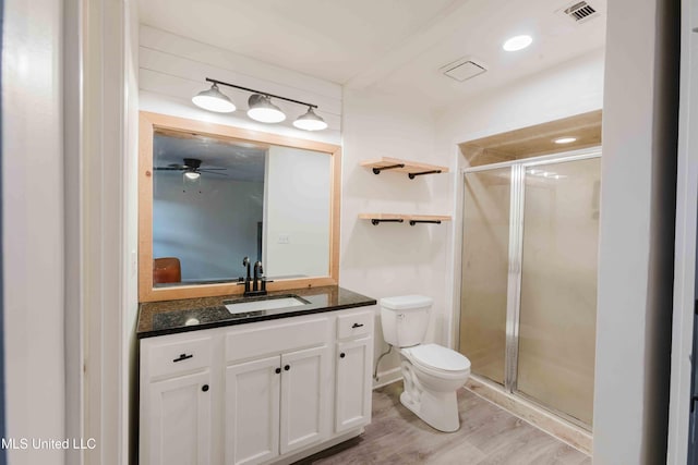 118 Dogwood Trl, Brandon, MS 39047 - full bathroom featuring toilet, a shower stall, wood finished floors, and vanity