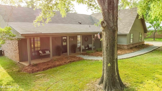 118 Dogwood Trl, Brandon, MS 39047 - back of house with a lawn, roof with shingles, and cooling unit