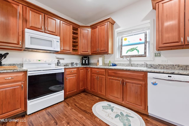 223 Sycamore St, Bay Saint Louis, MS 39520 - kitchen with a sink, dark wood-style flooring, white appliances, and light stone countertops