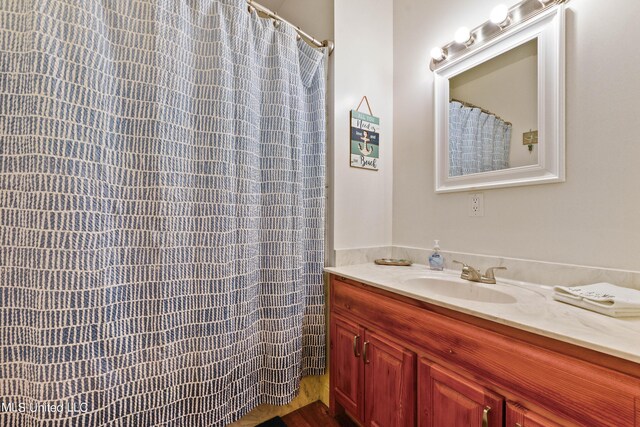 223 Sycamore St, Bay Saint Louis, MS 39520 - bathroom featuring vanity and curtained shower
