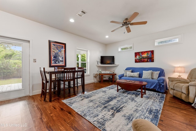 223 Sycamore St, Bay Saint Louis, MS 39520 - living area featuring ceiling fan, visible vents, a healthy amount of sunlight, and wood finished floors