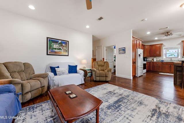 223 Sycamore St, Bay Saint Louis, MS 39520 - living room with ceiling fan, dark wood-style flooring, and visible vents