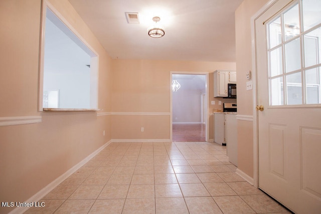 interior space with a healthy amount of sunlight and light tile patterned floors