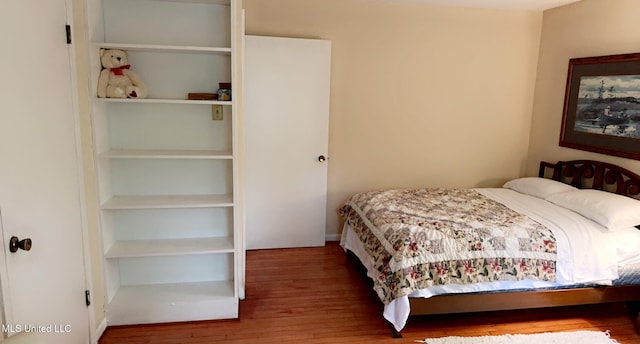 bedroom with wood finished floors