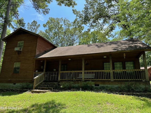 rustic home with a porch, cooling unit, crawl space, and a front lawn