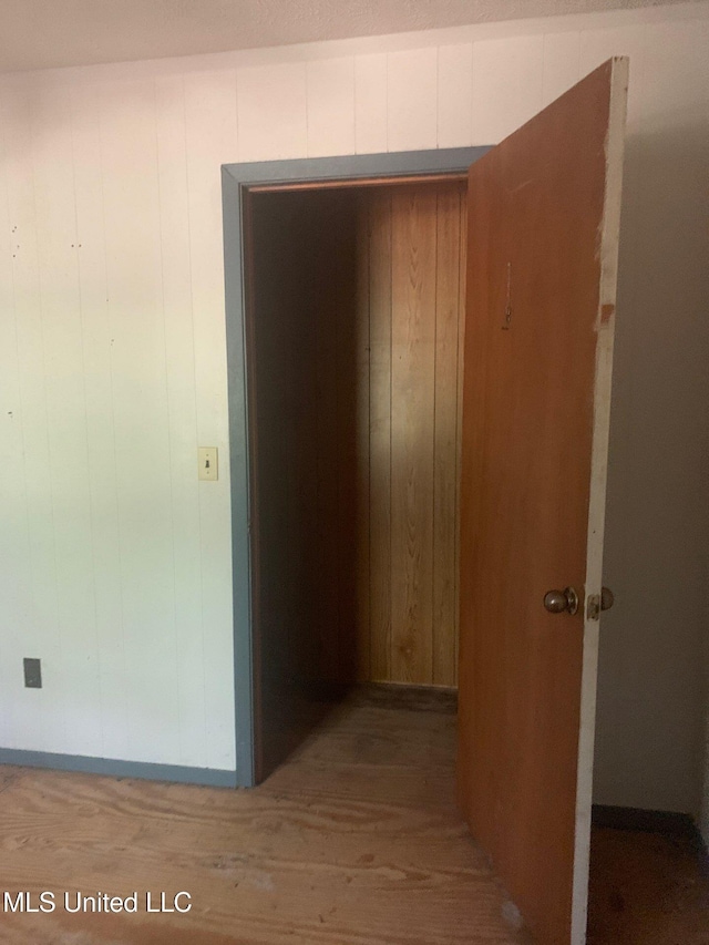 1356 Old River Rd, Harrisville, MS 39082 - hall featuring wood finished floors and wooden walls