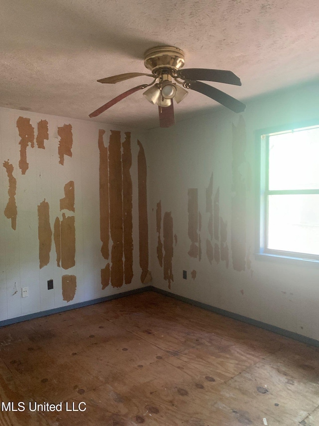 1356 Old River Rd, Harrisville, MS 39082 - spare room with a textured ceiling, ceiling fan, and baseboards