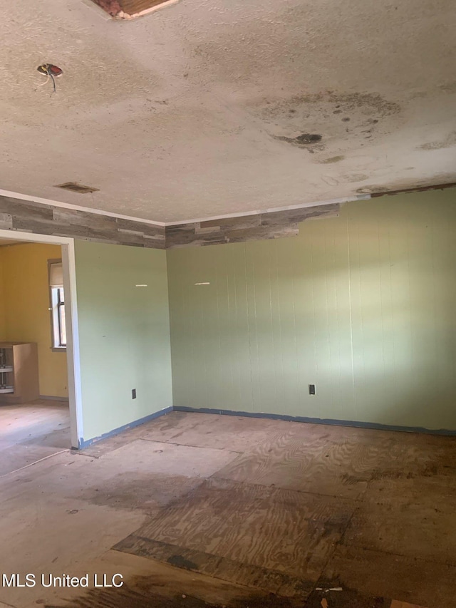 1356 Old River Rd, Harrisville, MS 39082 - unfurnished room with a textured ceiling and baseboards