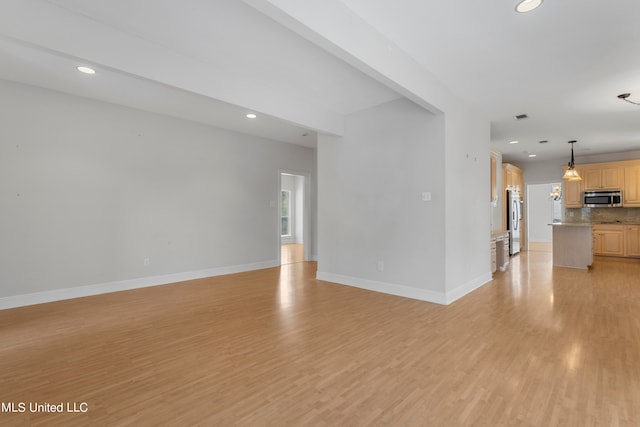 unfurnished living room with light wood-type flooring