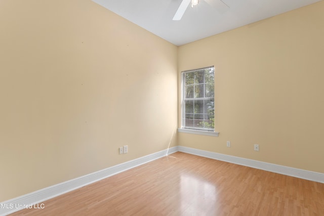 empty room featuring ceiling fan and wood-type flooring