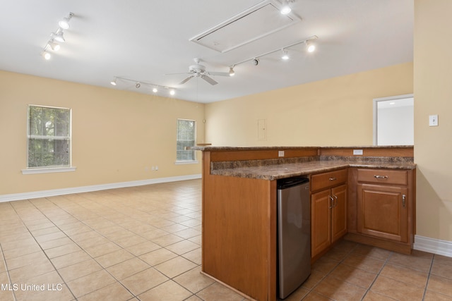 kitchen with track lighting, light tile patterned flooring, ceiling fan, and plenty of natural light