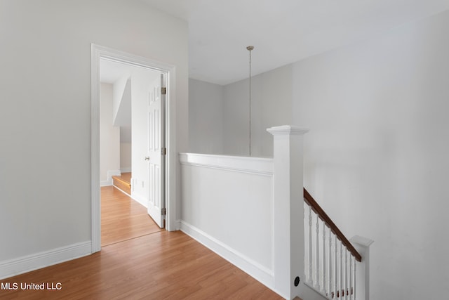 hall with wood-type flooring