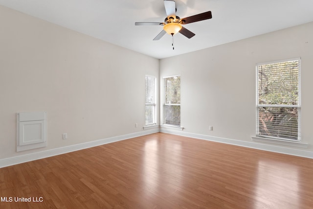 spare room with light hardwood / wood-style floors and ceiling fan