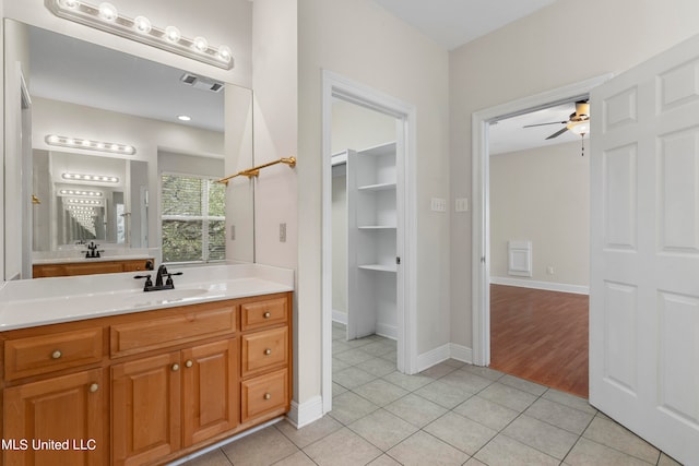 bathroom with vanity, ceiling fan, and tile patterned floors