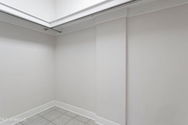 spacious closet featuring light tile patterned floors