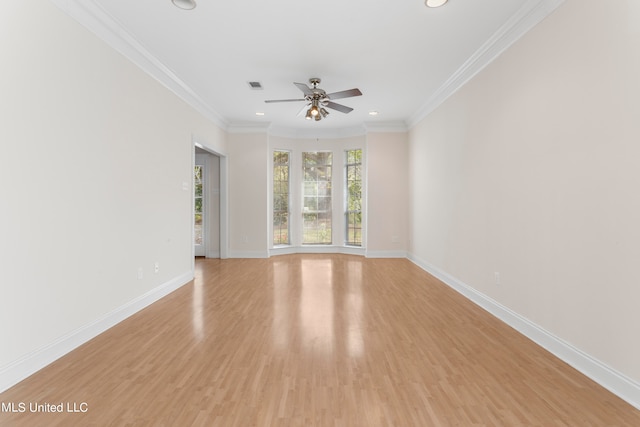 unfurnished room featuring ornamental molding, light wood-type flooring, and ceiling fan