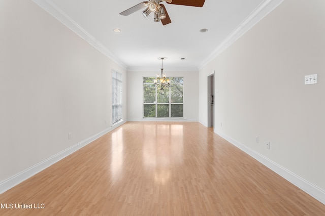 spare room with ornamental molding, light wood-type flooring, and ceiling fan with notable chandelier