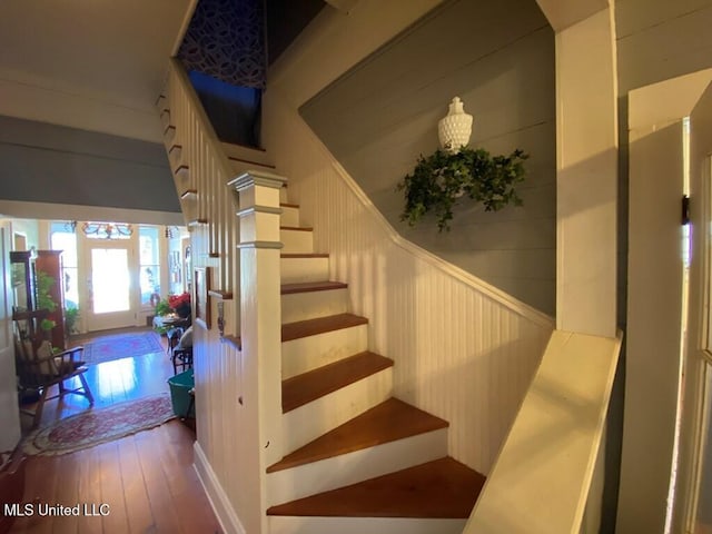 staircase featuring hardwood / wood-style flooring