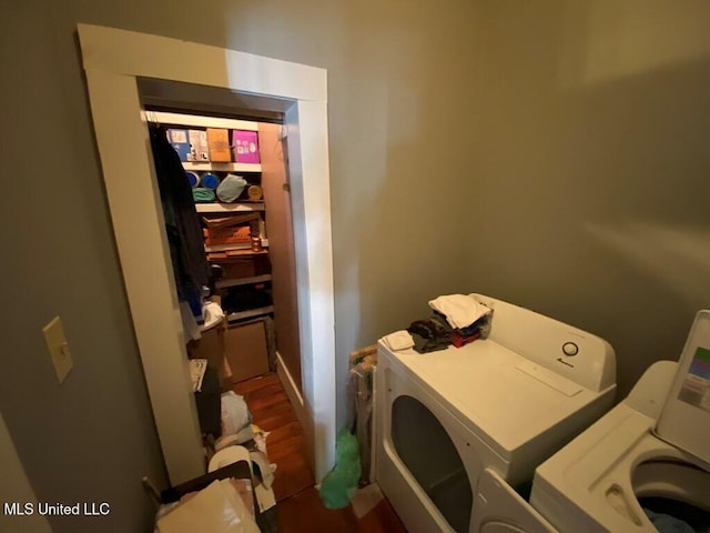 washroom featuring laundry area and washing machine and dryer