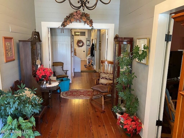 corridor with hardwood / wood-style floors