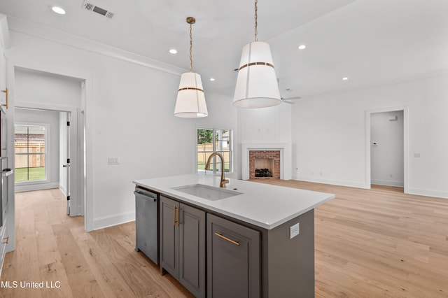 103 Hutto Ln, Madison, MS 39110 - kitchen with dishwasher, decorative light fixtures, light countertops, light wood-type flooring, and recessed lighting