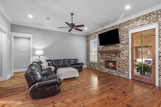 213 Wellington Way, Brandon, MS 39047 - living room with a fireplace, a ceiling fan, ornamental molding, wood finished floors, and baseboards
