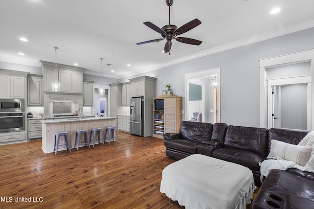 213 Wellington Way, Brandon, MS 39047 - living room featuring ornamental molding, a ceiling fan, dark wood finished floors, and recessed lighting