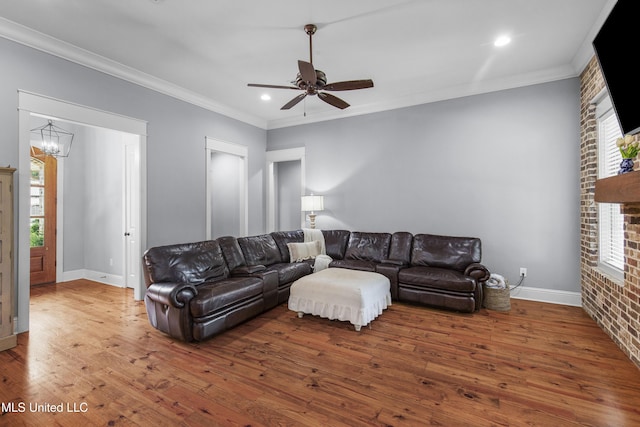 213 Wellington Way, Brandon, MS 39047 - living area with wood finished floors, crown molding, a chandelier, a ceiling fan, and baseboards