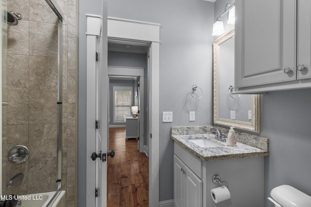 213 Wellington Way, Brandon, MS 39047 - full bath with toilet, wood finished floors, vanity, shower / washtub combination, and baseboards