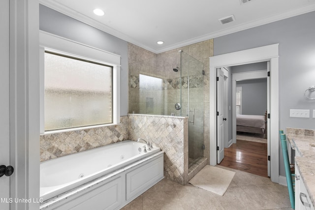 213 Wellington Way, Brandon, MS 39047 - ensuite bathroom featuring ornamental molding, a stall shower, a whirlpool tub, vanity, and tile patterned flooring