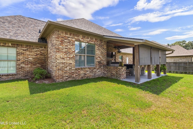 213 Wellington Way, Brandon, MS 39047 - rear view of house featuring brick siding, a patio area, and roof with shingles