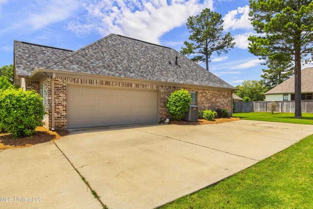 213 Wellington Way, Brandon, MS 39047 - view of property exterior featuring concrete driveway, brick siding, and a garage
