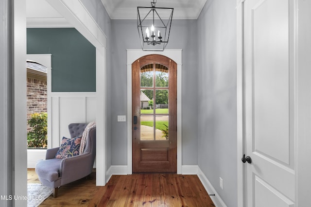 213 Wellington Way, Brandon, MS 39047 - entryway featuring a chandelier, dark wood-style flooring, baseboards, and wainscoting