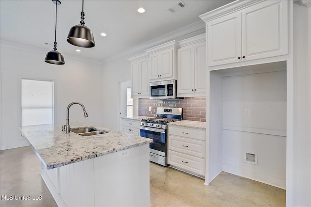 kitchen with white cabinetry, stainless steel appliances, light stone countertops, and sink