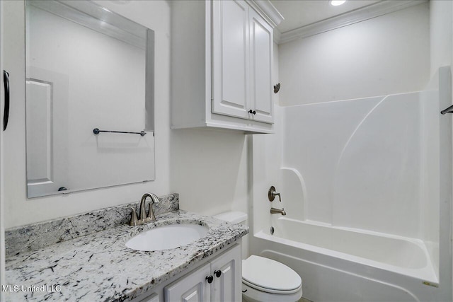 full bathroom featuring vanity, ornamental molding, toilet, and shower / washtub combination