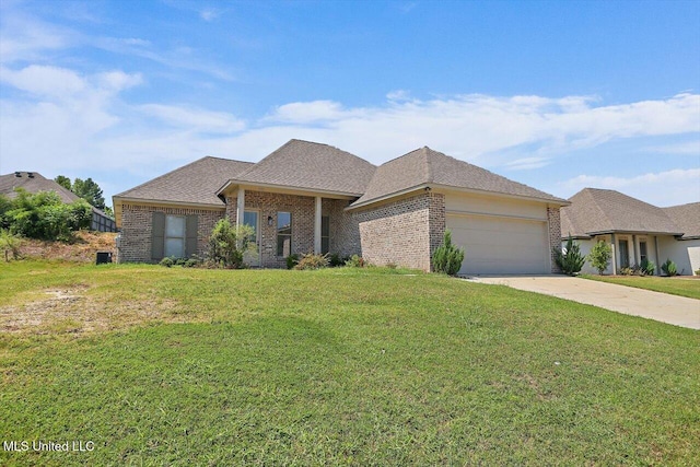 view of front of property with a garage and a front lawn