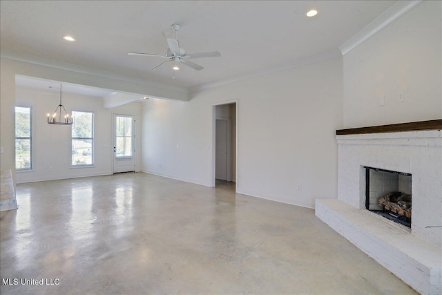 unfurnished living room featuring ceiling fan with notable chandelier, a fireplace, and ornamental molding