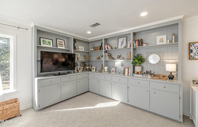 kitchen featuring open shelves, visible vents, light countertops, and ornamental molding