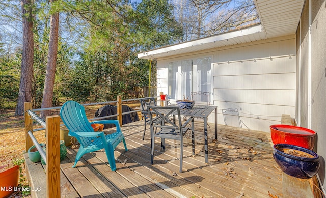 wooden deck with outdoor dining area