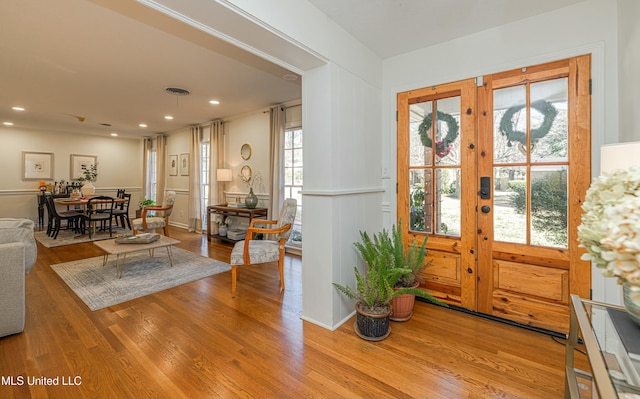 entryway featuring baseboards, visible vents, wood finished floors, french doors, and recessed lighting