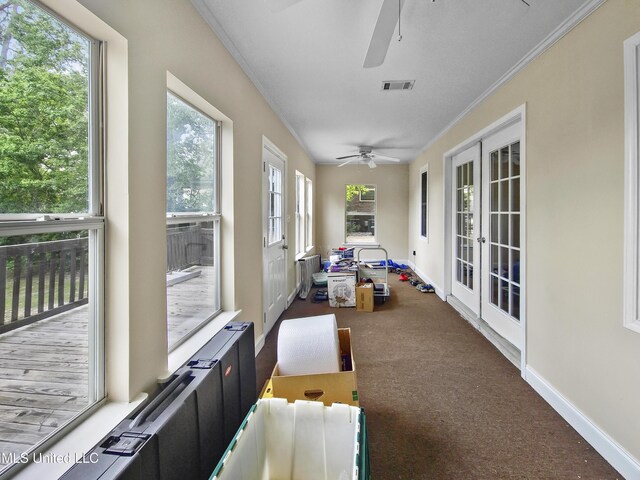 sunroom / solarium featuring visible vents and french doors