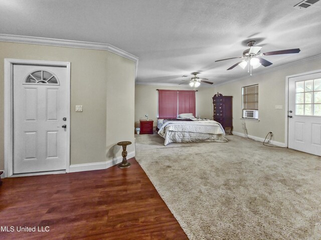 bedroom featuring baseboards, ornamental molding, cooling unit, and visible vents