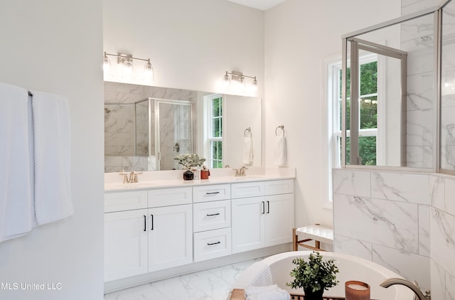 bathroom with shower with separate bathtub and vanity