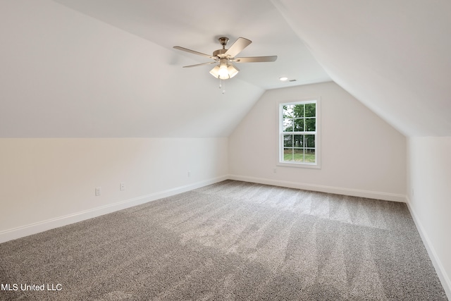 bonus room featuring ceiling fan, carpet, and lofted ceiling