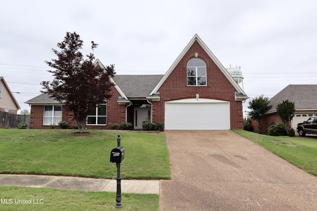 traditional-style home featuring brick siding, driveway, and a shingled roof