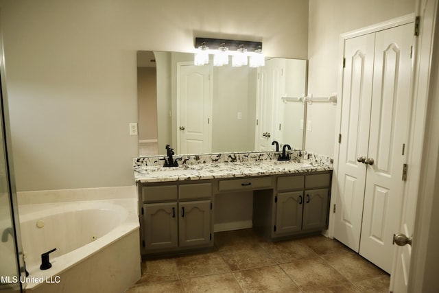 full bathroom with a whirlpool tub and double vanity