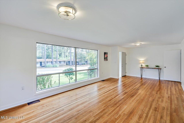 unfurnished living room with light hardwood / wood-style flooring