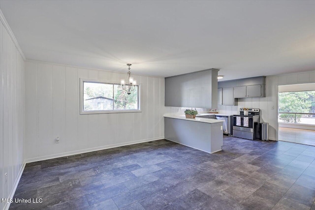 kitchen with pendant lighting, kitchen peninsula, plenty of natural light, and stainless steel appliances